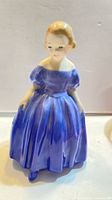 Front view of Royal Doulton “Marie” figurine showing dress and pose