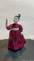 Front view of Royal Doulton Vanity figurine showing full attire and mirror