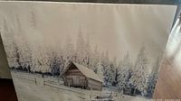Front view of canvas showing full winter cabin scene