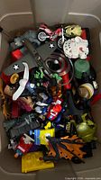 Top view of bin showing airplane, motorcycle, Millennium Falcon piece, grenade, action figures