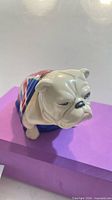 Front angled view of bulldog figurine showing facial detail and glaze