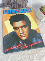 Front cover showing Elvis portrait, title, author and preface credit