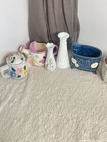 Group shot of five ceramic items