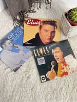 Front covers of three Elvis Presley mini calendars