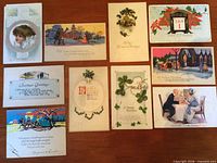 All nine postcards laid out to show fronts and graphics