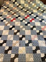 Full view of Bow Tie quilt on queen bed