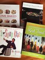 All four cookbooks front covers visible