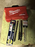 Milwaukee closed case, Bosch bit in card, three SDS bits, Colt bit in sleeve