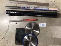 Group view of both saw blades, poly roll, drill bit tube, threshold strip and sleeve