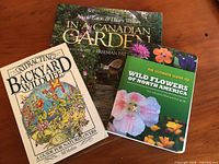 Front covers of three books In A Canadian Garden, Attracting Backyard Wildlife, Wild Flowers Of North America
