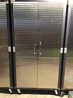 Front view of closed metal cabinet on casters