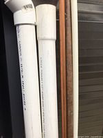 White Ipex PVC pipe, copper pipe and narrow white pipe