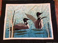 Full view of quilted loon wall hanging showing entire design and borders