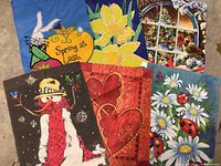 All six garden flags laid out showing designs
