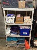 Full view of plastic shelving unit with contents showing overall design and dimensions