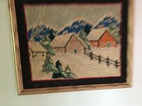 Full view of framed hooked wool wall art showing farm scene
