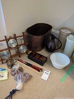 Overall view showing weather station, metal tub, pitchers, containers, bowl and miscellaneous items