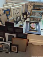 Assorted frames in multiple colors and sizes on tabletop
