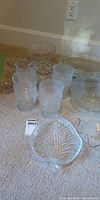 assortment of glass tumblers, bowls and leaf dish