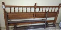Vilas maple king headboard with metal frame parts laid in front