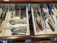 Drawer view showing flatware and utensils