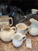 Group view of all ceramic and glass pitchers
