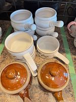 Group of assorted handled soup bowls in three styles