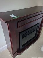 Full view of electric fireplace console, dark cherry veneer finish