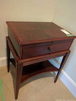 Full view of solid wood side table showing drawer and shelf