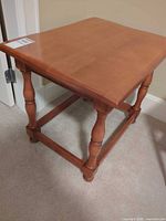 Full view of side table showing top, legs, and stretcher base