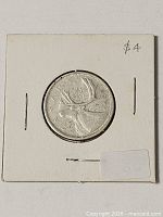 Coin in holder, obverse visible