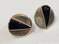 front view of both earrings showing geometric design