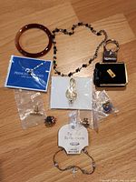 Overview of all 11 items spread on wooden surface