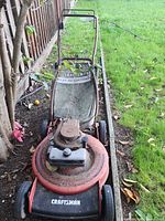 Full top view of mower showing deck, engine, handle
