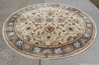 Full view of round rug showing entire design and colors