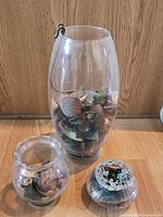 All three glass vessels together showing sizes and contents