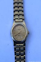 Front view of Seiko gold-tone women’s wristwatch showing dial and bracelet