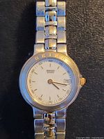 Front view of Seiko two-tone women’s quartz watch showing dial, bezel and bracelet