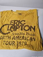 Yellow Eric Clapton 1979 tour T-shirt displayed folded