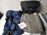 All three bags side by side on table