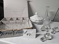 Open Serva-Snack box showing trays and cups, milk glass dish, decanter, loose stoppers