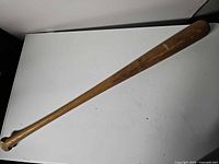 Full view of the wooden Louisville Slugger baseball bat