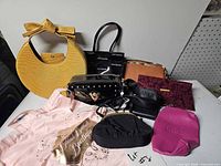 Overall view of all handbags, wallets and pouch items