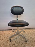 Full front view of chair showing seat, backrest and base