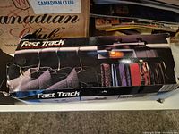Retail box showing Fast Track motorized organizer and graphics