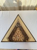 Full view of triangular Greg Copeland wall art