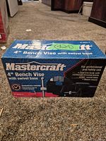 Boxed Mastercraft 4" bench vise front view showing model and features