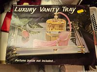 Retail box front showing vanity tray image and product details