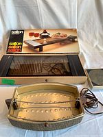 Warming tray in original box with instruction sheet visible