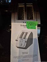 Front view of toaster with manual